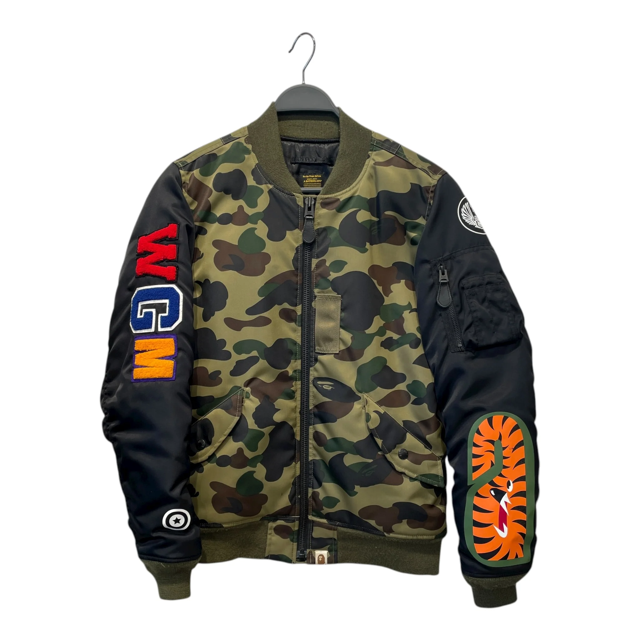 150-a-bathing-ape-flight-jkt-s-nylon-grn-camouflage-1st-camo-shark-ma-1-1.webp A BATHING APE/Flight Jkt/S/Nylon/GRN/Camouflage/1ST CAMO SHARK MA-1